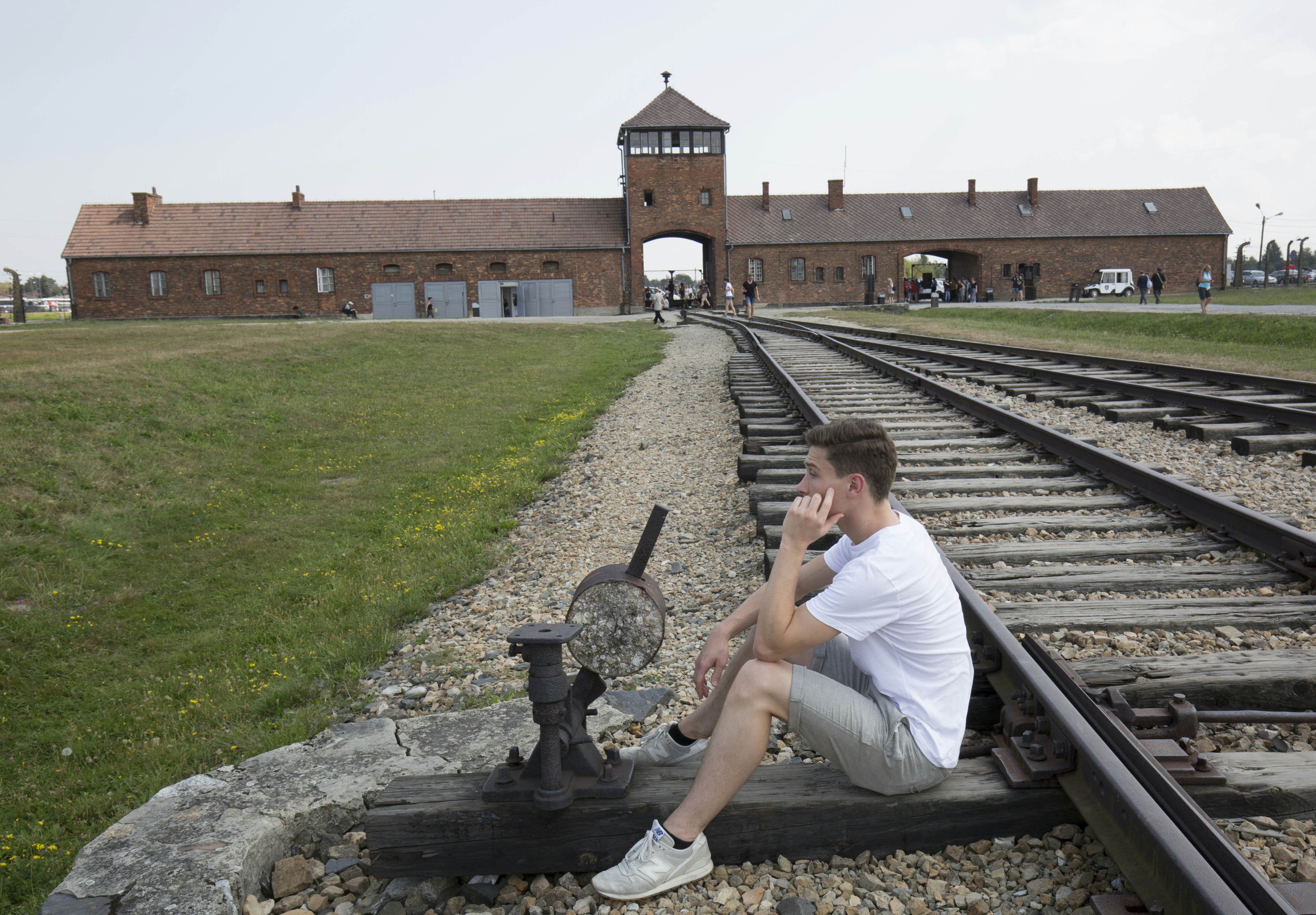 Is There An Appropriate Age To Bring Children To Visit Auschwitz   Young Man At Auschwitz Birkenau Holocaust Museum 